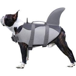 Shark-themed dog life jacket with secure straps, for safety and flotation. Suitable for different types of dogs.