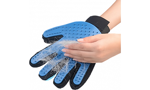 Blue grooming glove with dog hair accumulated, demonstrating its deshedding functionality, easy to wash material.